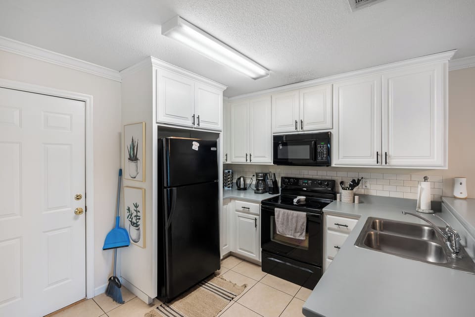 A bright kitchen with all the essentials you need to curate a delicious meal!