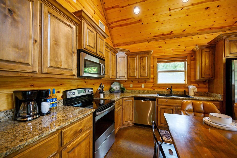 Double J Hideaway’s kitchen is fully stocked and includes an air fryer for easy meal prep.