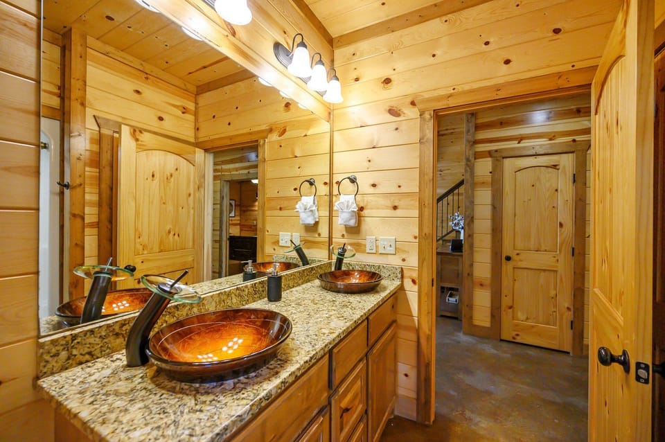 Main floor bathroom at Double J Hideaway features double vanities and is conveniently located off the living area.