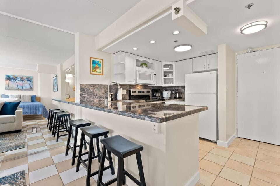 Hang out at the kitchen bar while planning your next trip down to the beach!