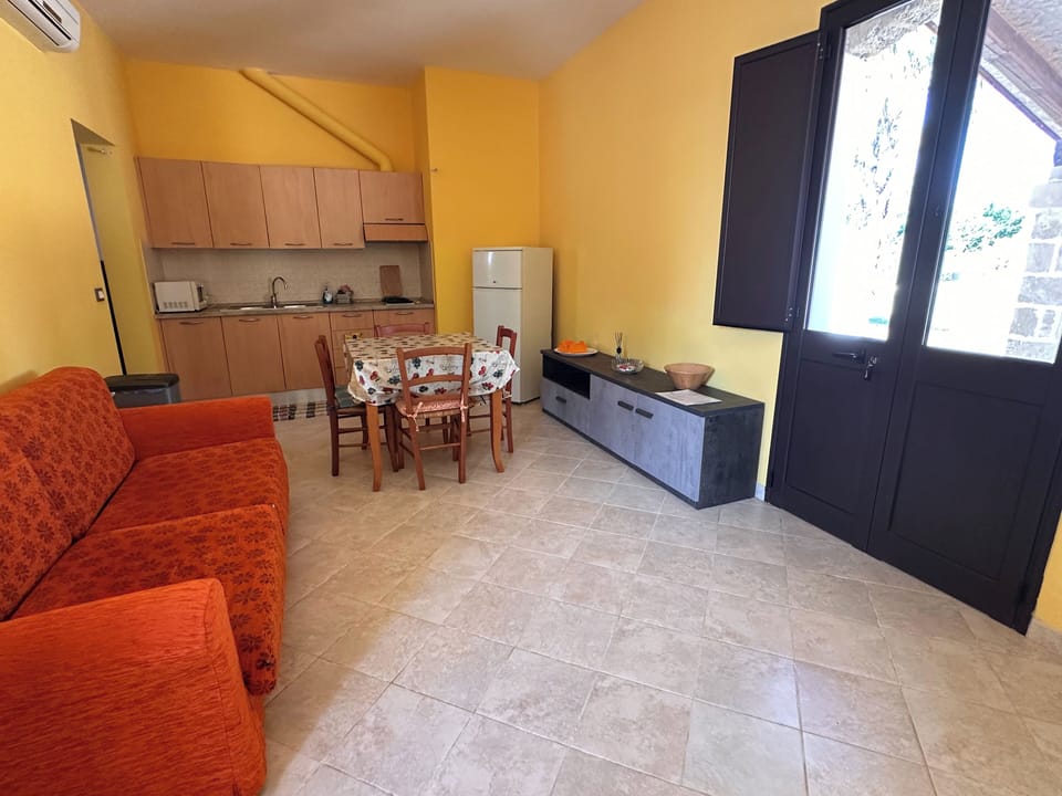 Apartment, Pool View | Living area | TV