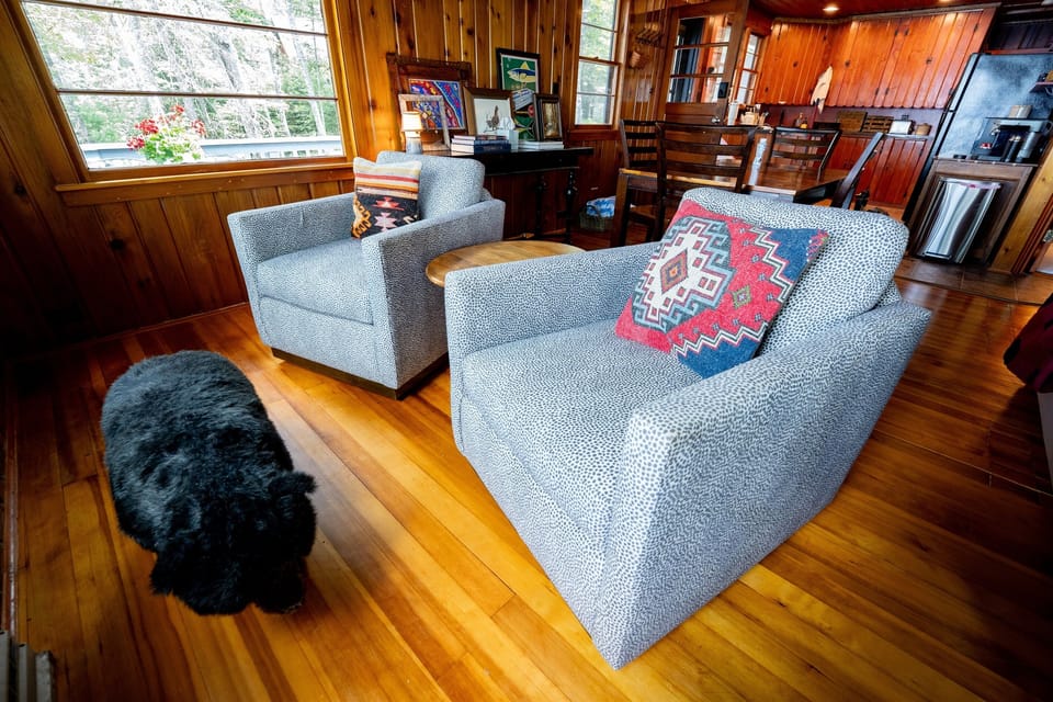 Kick your legs up on Travis the bear and unwind overlooking the lake!