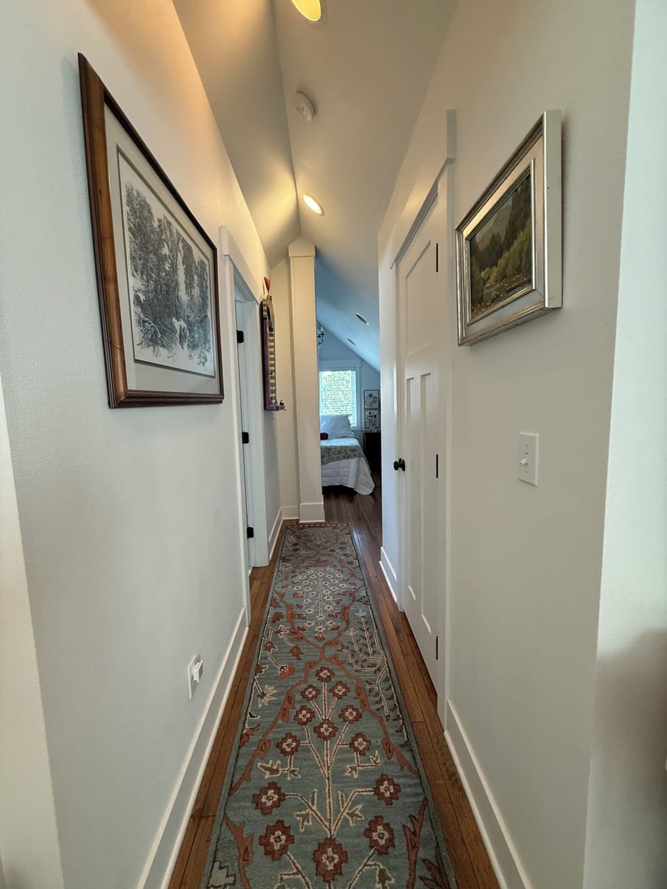 Open hallway between living room and bedroom