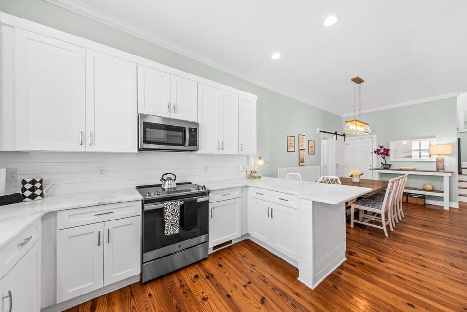 Kitchen is bright with new stainless steel appliances.