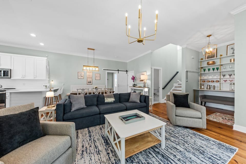 The living area is open to the kitchen and dining room.  Painted in a serene palate.