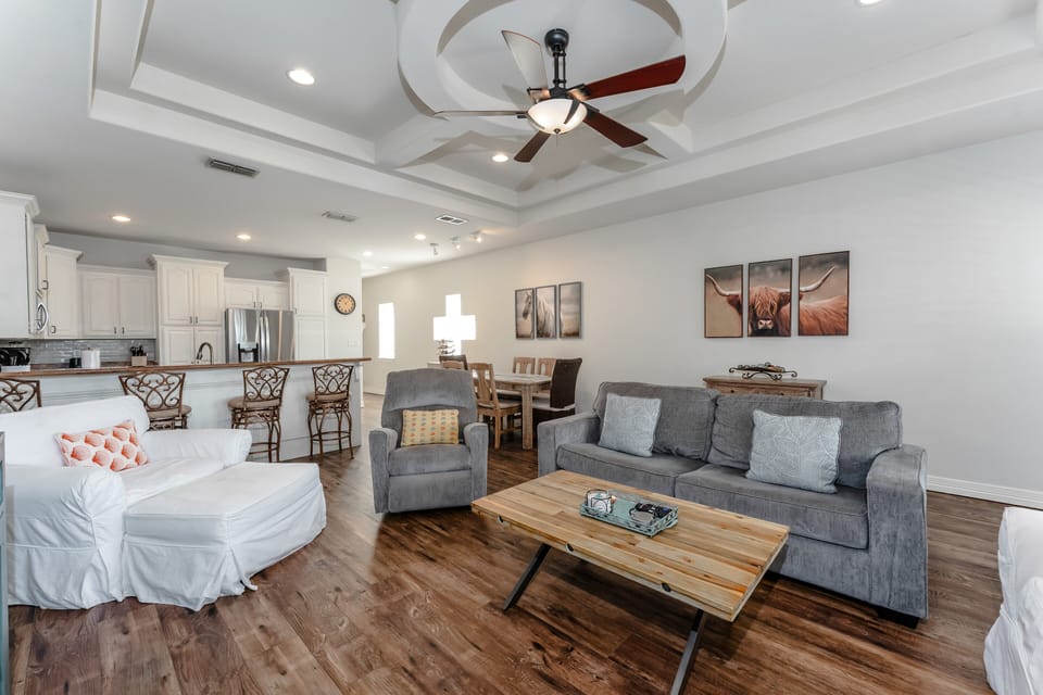 Beautiful open living space seamlessly connected to the kitchen and dining areas, perfect for gathering and entertaining.
