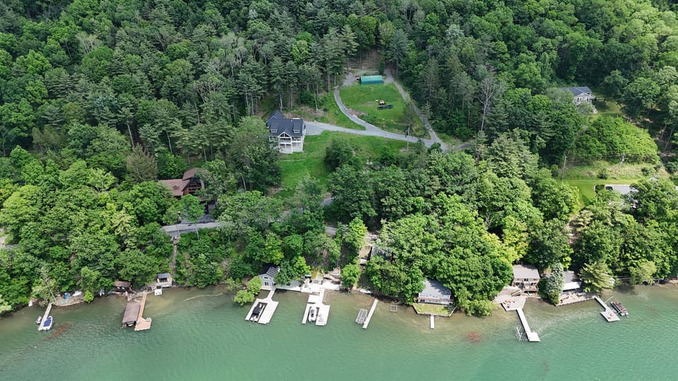 Secluded lakefront retreat with wooded views and private dock—nature and relaxation in one spot! 🌲🏡🌊