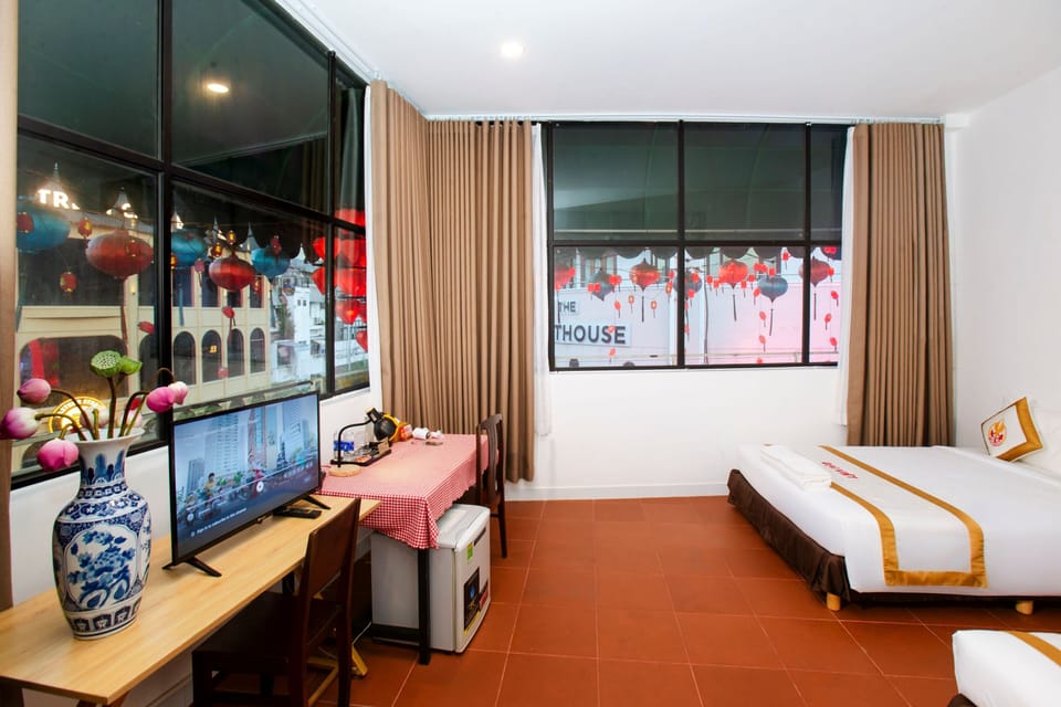 Deluxe Triple Room, City View | Premium bedding, minibar, desk, blackout drapes