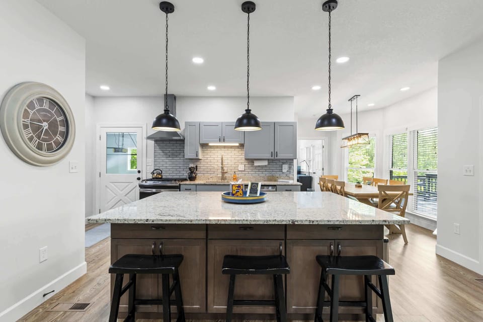 Step into a fully stocked kitchen with high-end appliances and plenty of cooking space, perfect for creating culinary masterpieces. Plus, easy access to the outdoor area makes entertaining a breeze.
