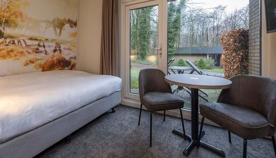 Sip morning coffee by the window overlooking peaceful greenery.