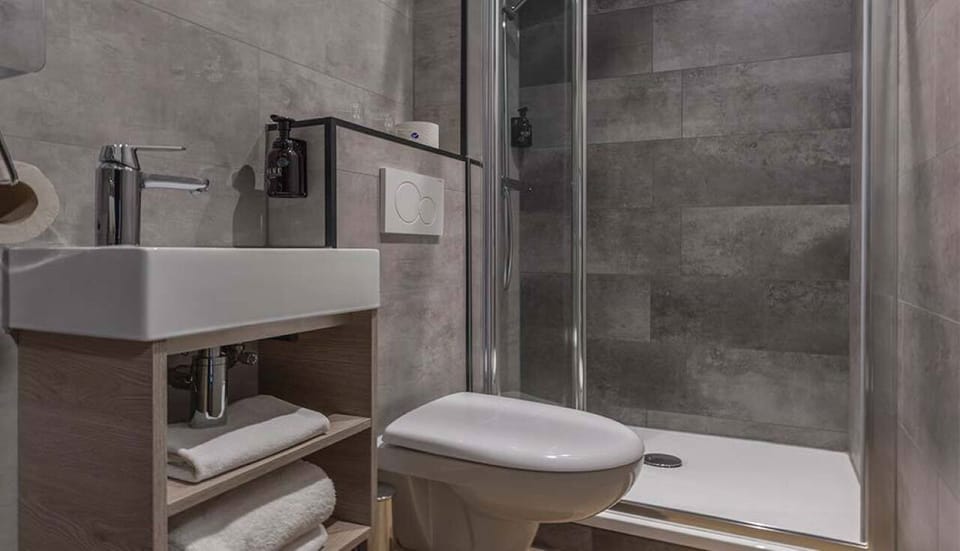 Enjoy a spotless ensuite with fresh towels always within reach.