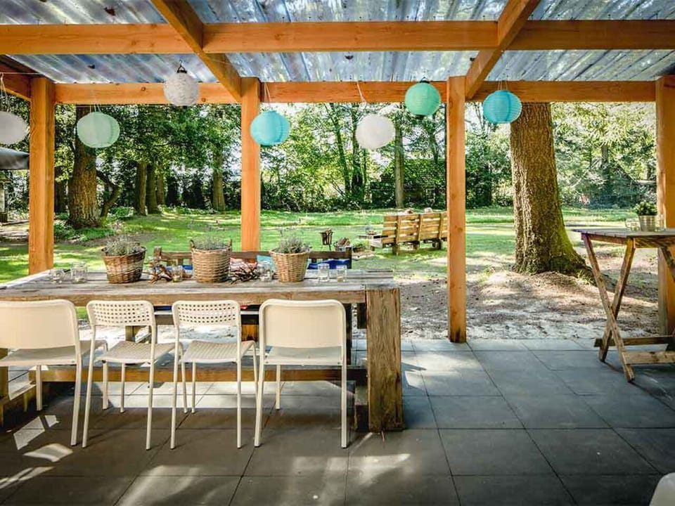 Gather for long, laughter-filled meals overlooking the forest lawn.