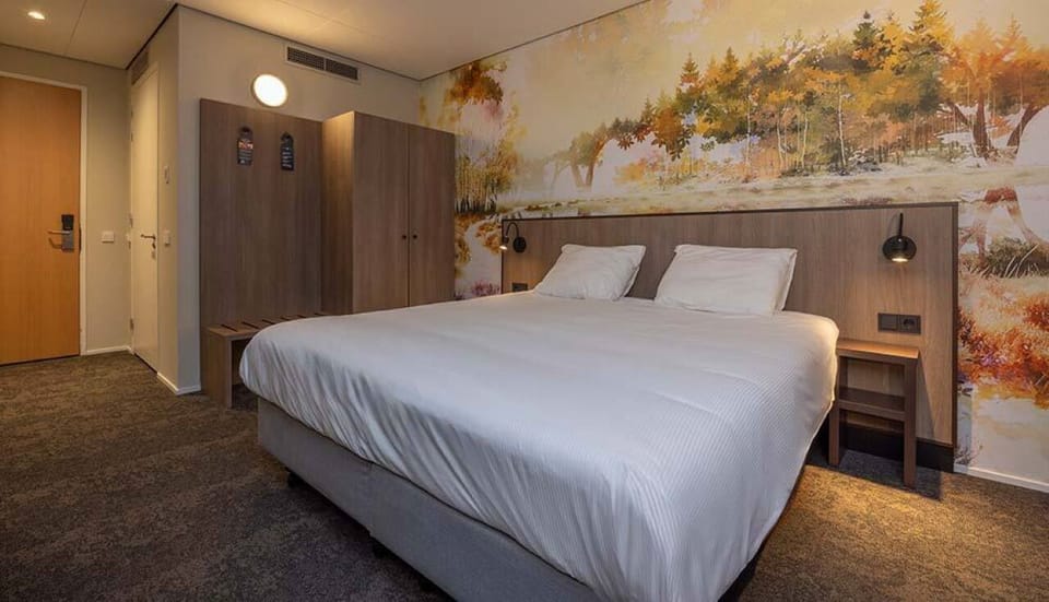 Relax into a serene bedroom with warm lighting and storage.