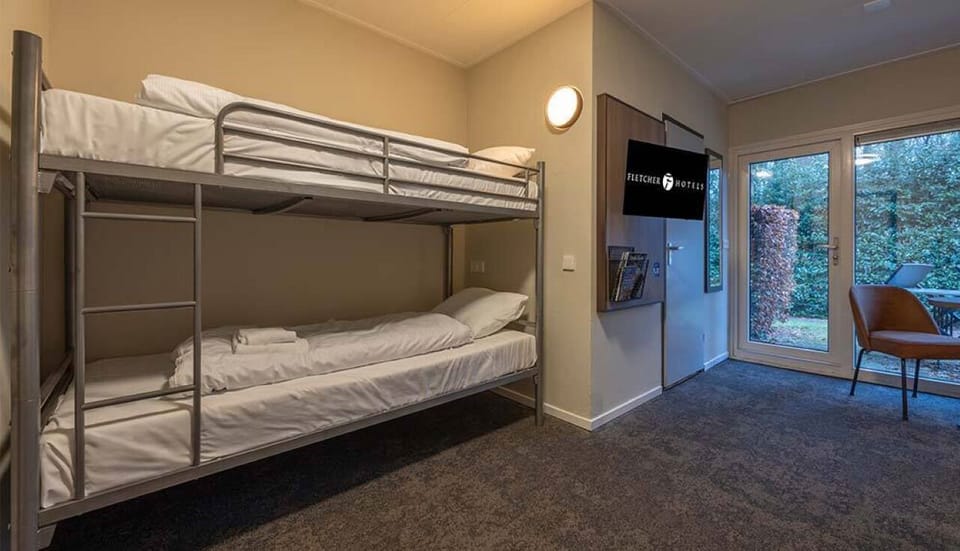 Gather the family in a comfy room with bunks included.