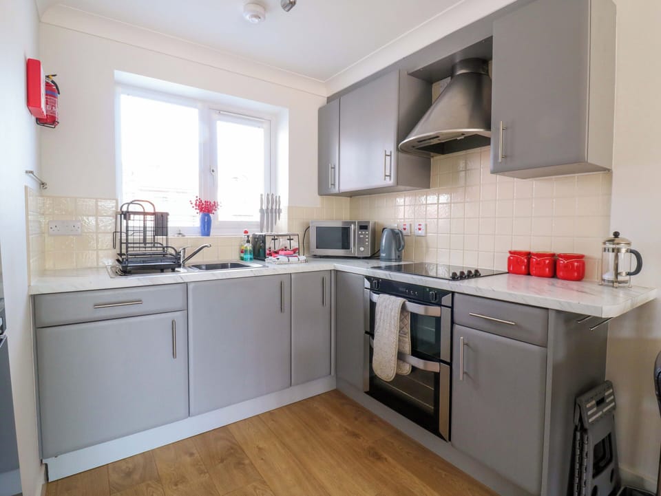Fridge, microwave, toaster, cookware/dishes/utensils