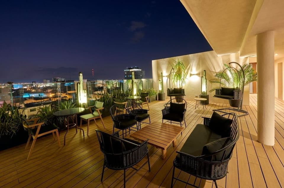 Stretch out on stylish lounges and savor the night breeze.