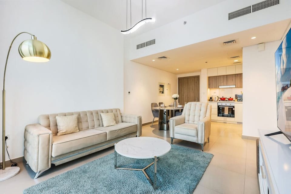 Stylish Living Room: Modern elegance with plush furnishings and a chic dining area awaits you!