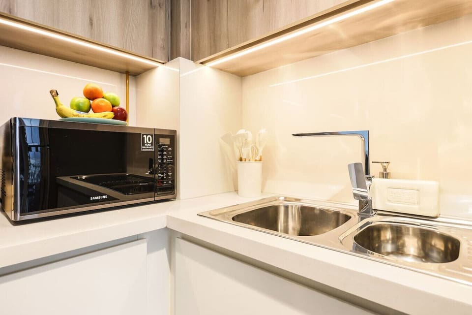 Modern Kitchen: Enjoy culinary adventures in this sleek space with top-notch appliances and vibrant decor!