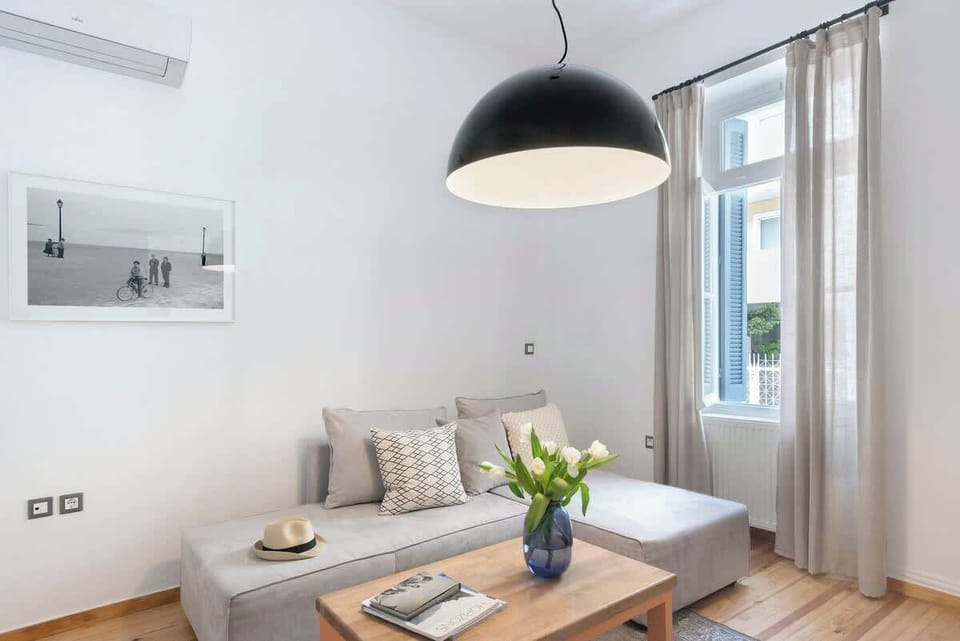 Living Room with Dining Space – Cozy area with natural light and modern lighting.

