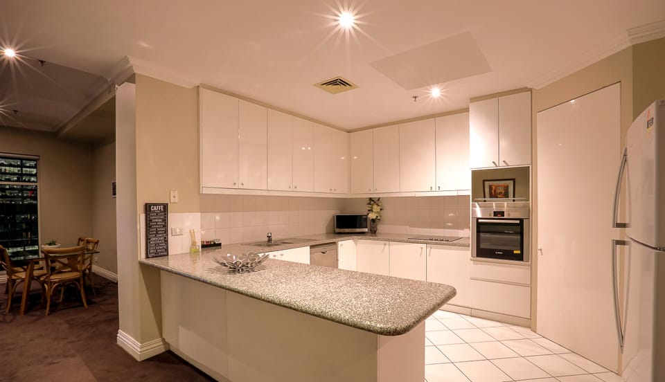 Two Bedroom One Bathroom Executive Apartment | Private kitchen | Full-size fridge, microwave, stovetop, dishwasher