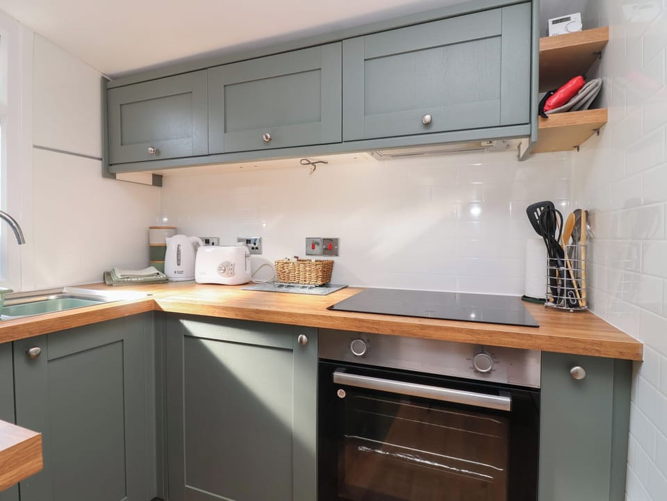 Fridge, microwave, toaster, cookware/dishes/utensils