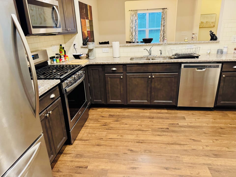 kitchen with cooking basics and dishware, air fryer, microwave, toaster, keurig