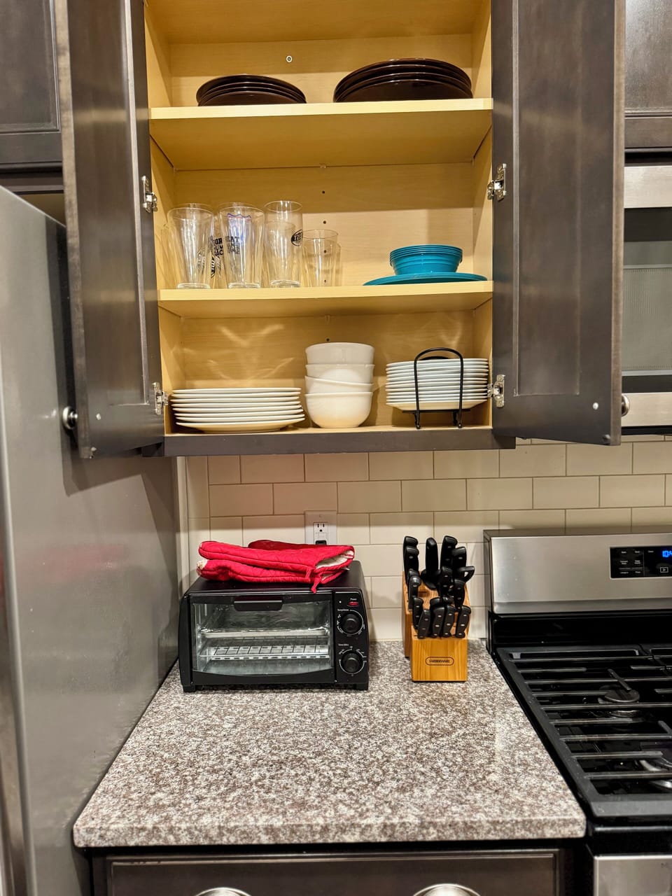 kitchen with cooking basics and dishware, air fryer, microwave, toaster, keurig