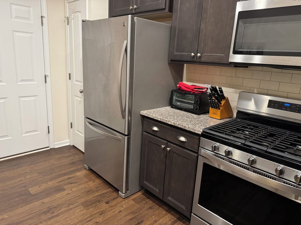 kitchen with cooking basics and dishware, air fryer, microwave, toaster, keurig