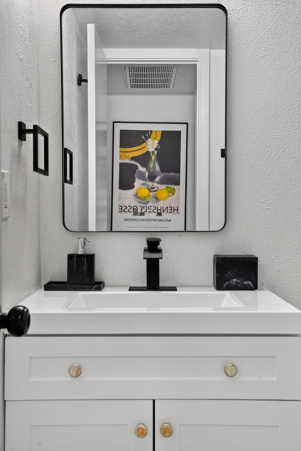 Full Bathroom | Enjoy statement tile flooring, sleek matte black finishes, a wal