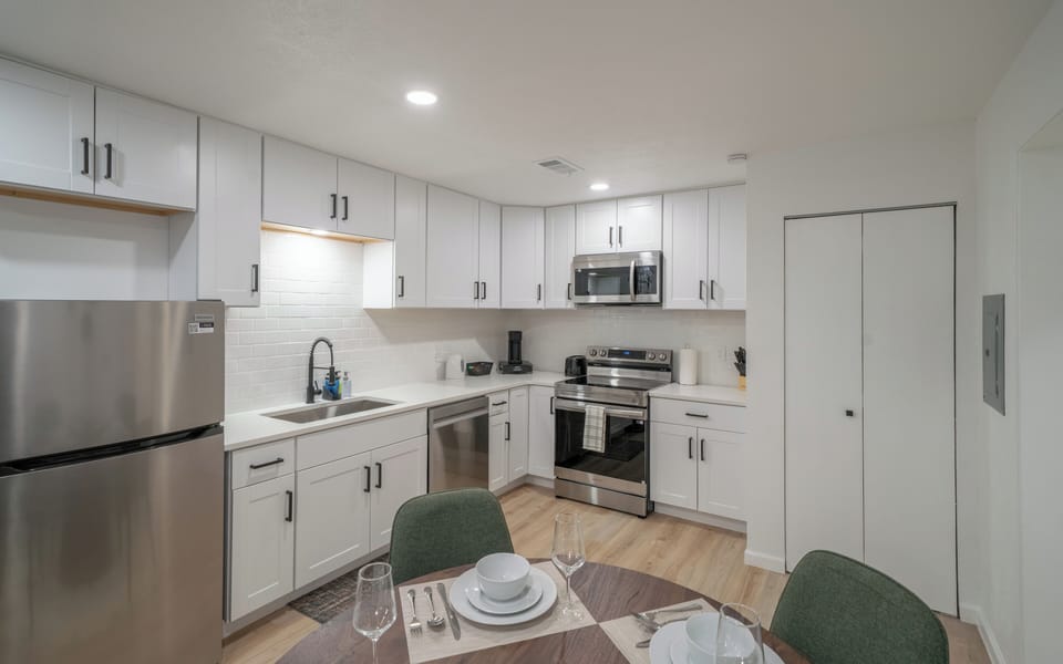 Full Kitchen | Enjoy bright white cabinetry, stainless steel appliances, quartz 