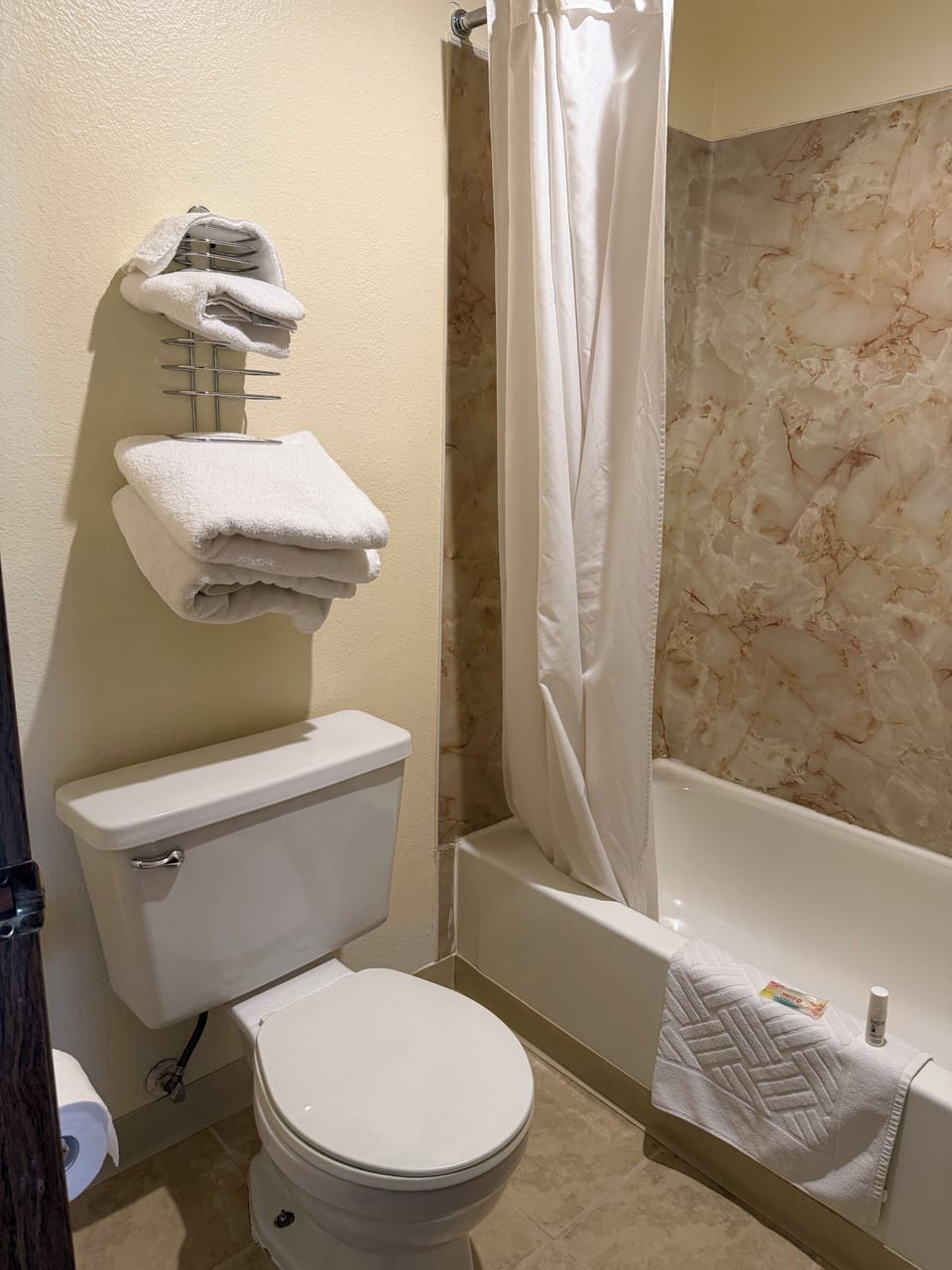 Combined shower/tub, towels, soap, toilet paper