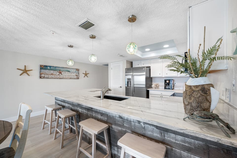 Open updated kitchen with gorgeous countertops!