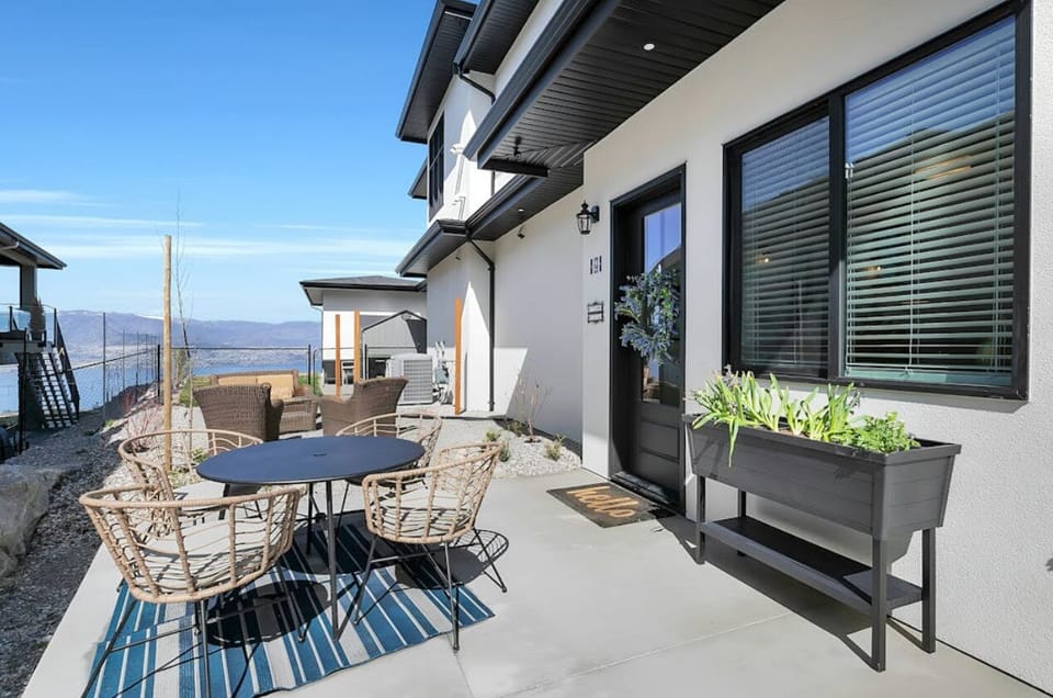 Outdoor patio has spectacular Lakeview, dining table and loungers