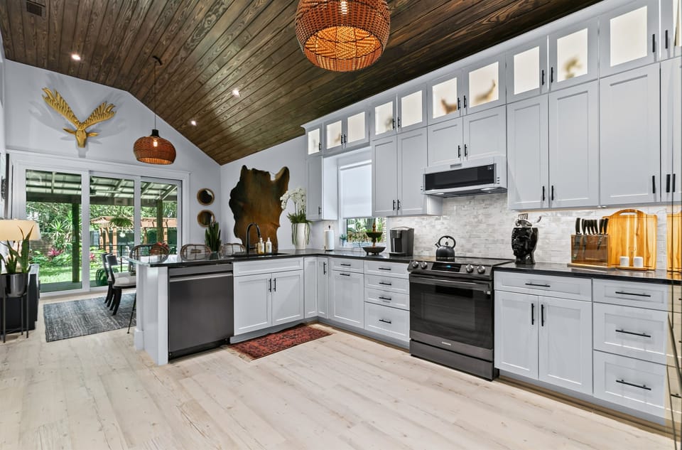 Large area for entertaining leads to backyard and covered porch