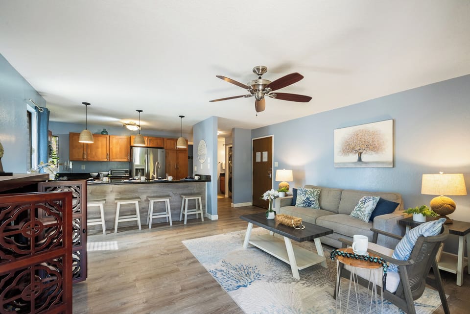 Open-concept living room with easy flow to the kitchen and lanai.