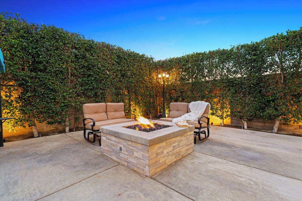 Cozy fire pit area with comfortable seating.