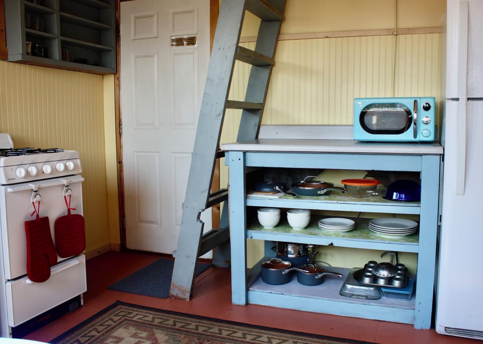 Kitchen and ladder to the sleeping loft.