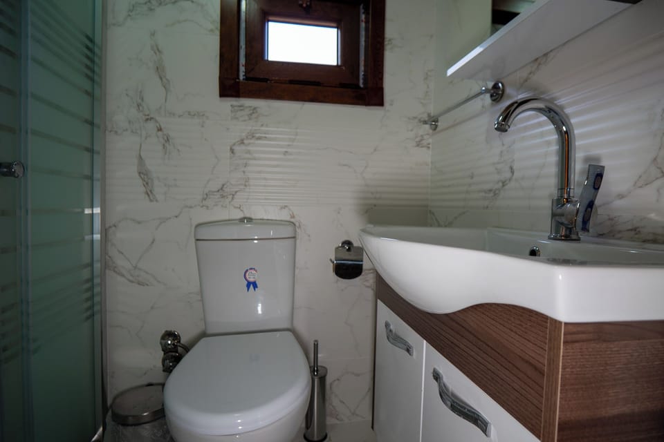 Shower, hair dryer, slippers, towels