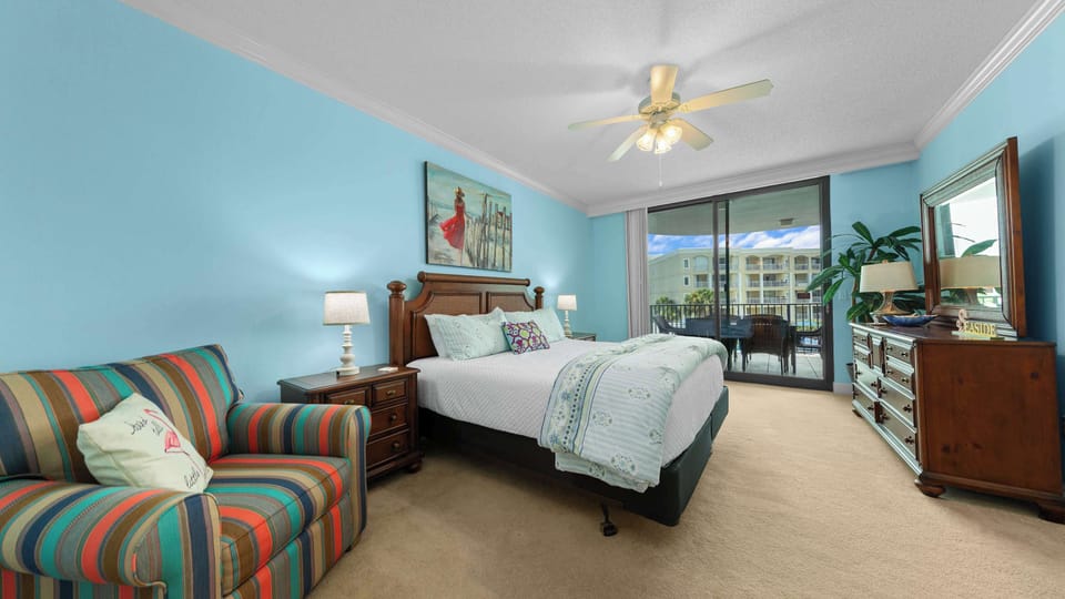 This private primary suite has an extra chair, a full ensuite with a double vanity, and balcony access! 