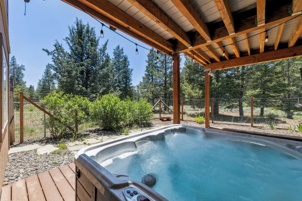 Unwind in your private hot tub surrounded by towering pines and natural beauty.