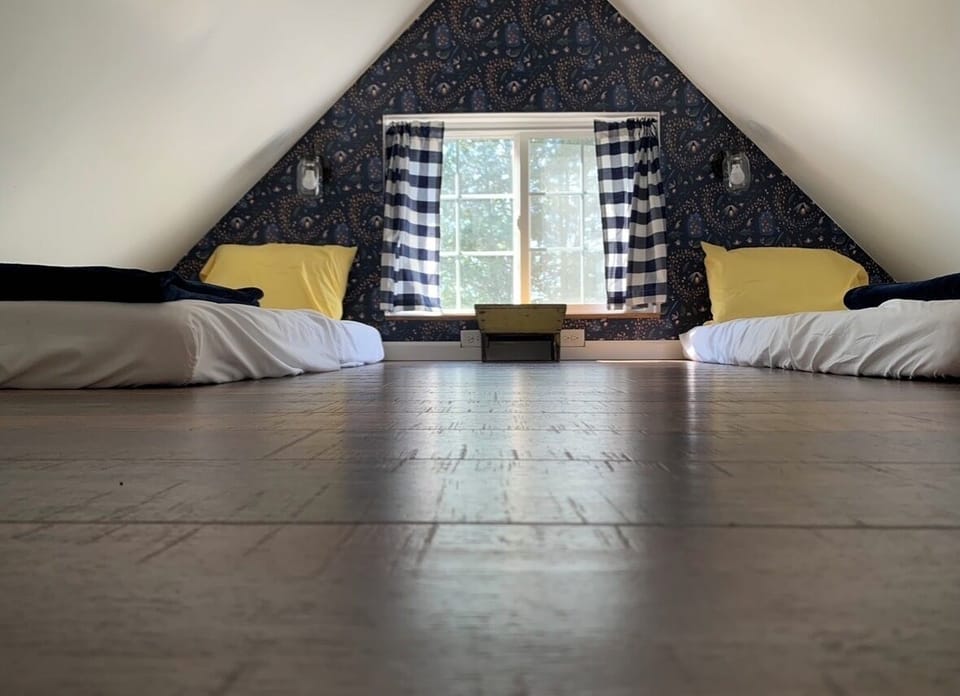 sleeping loft has 2, twin XL beds
