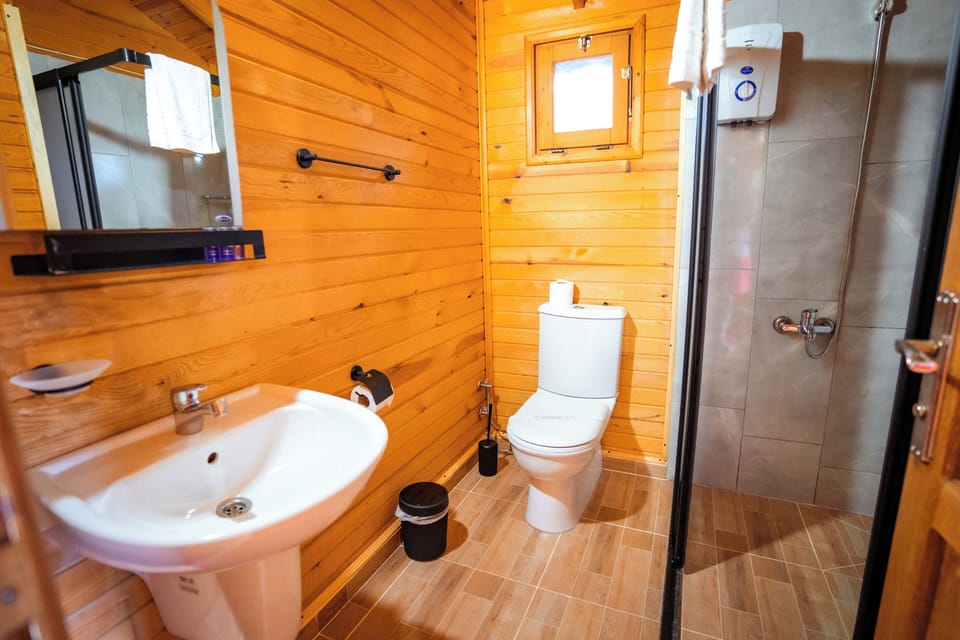Standard Room, Multiple Beds, Garden View | Bathroom | Shower, hair dryer, towels, soap