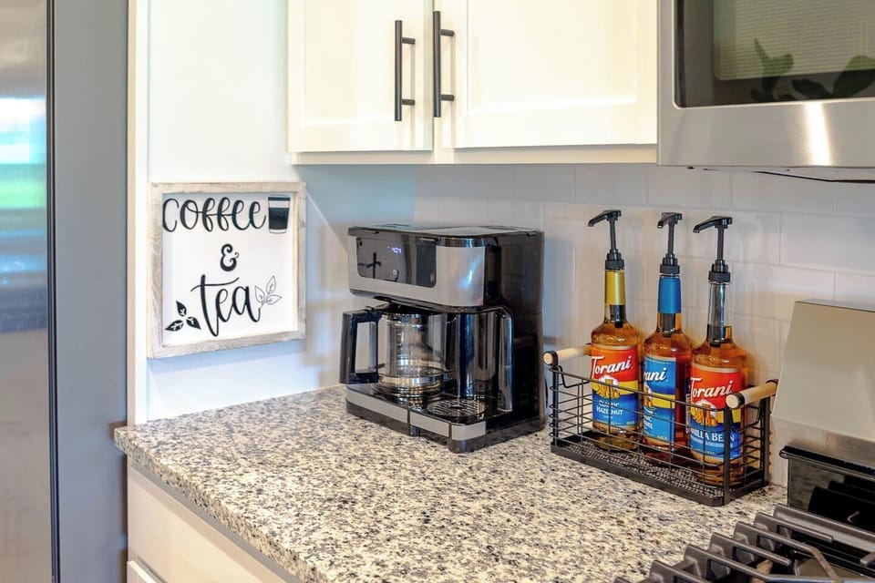 Start your mornings right at our coffee station, featuring a versatile brewer for single cups or full pots, plus a trio of Torani syrups for the perfect personalized pick-me-up.