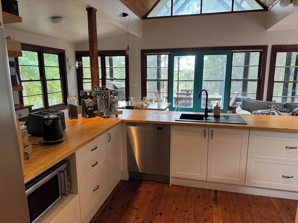 Large kitchen with coffee machine.