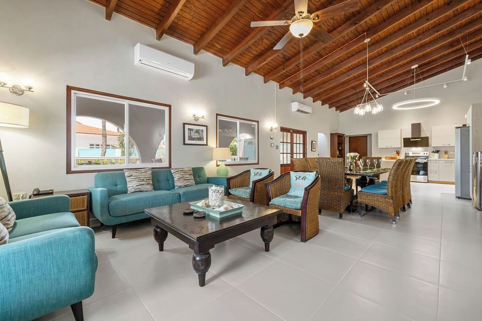 nwind after a day out or enjoy a movie night in this bright, breezy space with 2 comfortable sofas, full air conditioning, cable TV, and easy access to the patio and pool.
