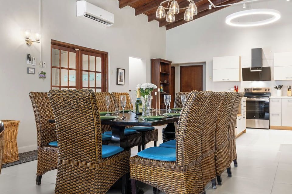 Spacious dining table with seating for 8 in an open kitchen area — perfect for family dinners, casual breakfasts, or game nights, all while staying connected to the heart of the home