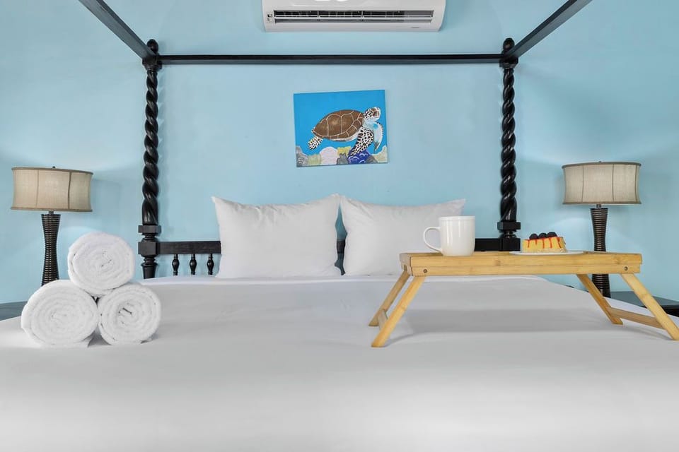 Cozy bedrooms feature private ensuite bathrooms, individual A/C units, closets, and premium linens for a restful night’s sleep.