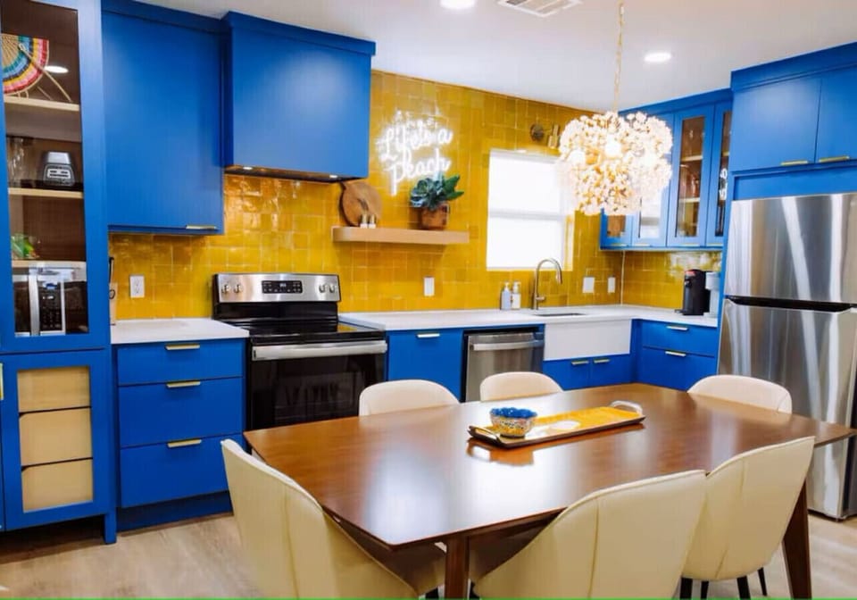 {Kitchen} Fully equipped kitchen and dining area w/ utensils, dishes, and flatware