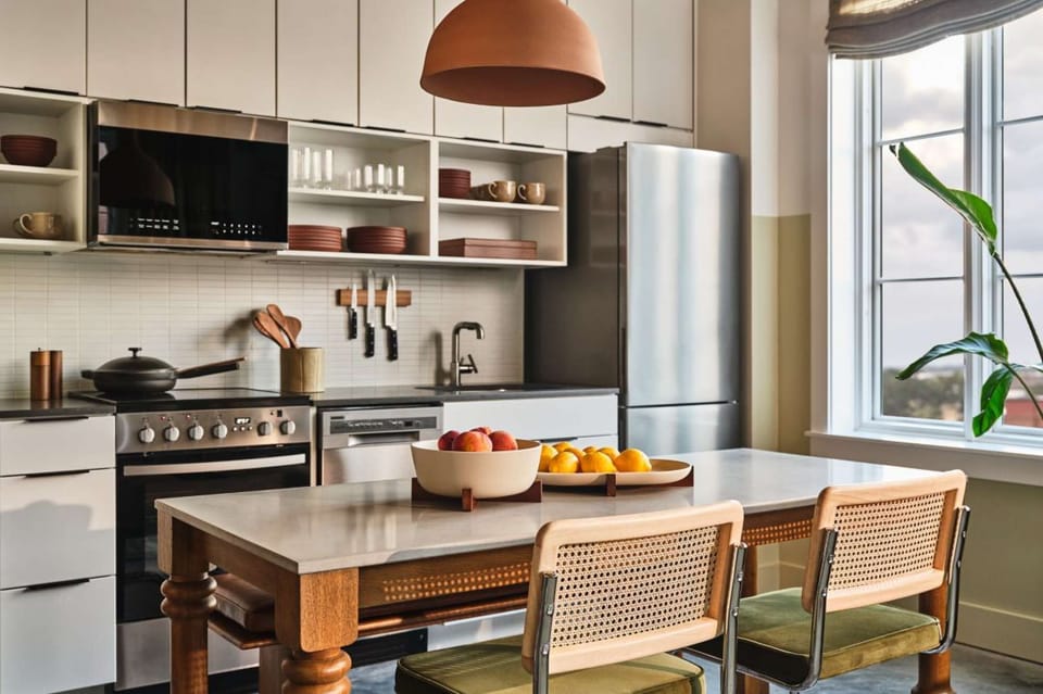 Kitchen with wood dining table and open shelves for easy meals