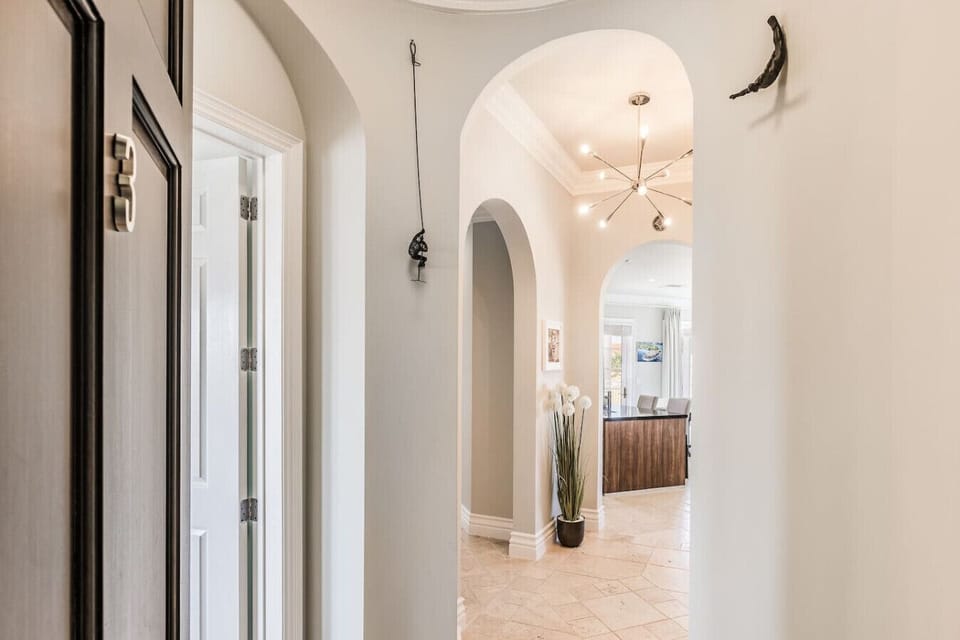 The elegant entrance door of Anabui 3 sets the tone for luxury, welcoming you into a world of sophisticated design and stunning island views.